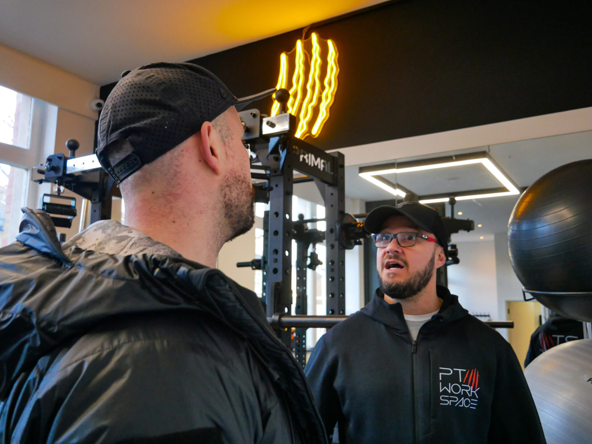 Trainer viewing the gym rental facilities at PT Workspace in London