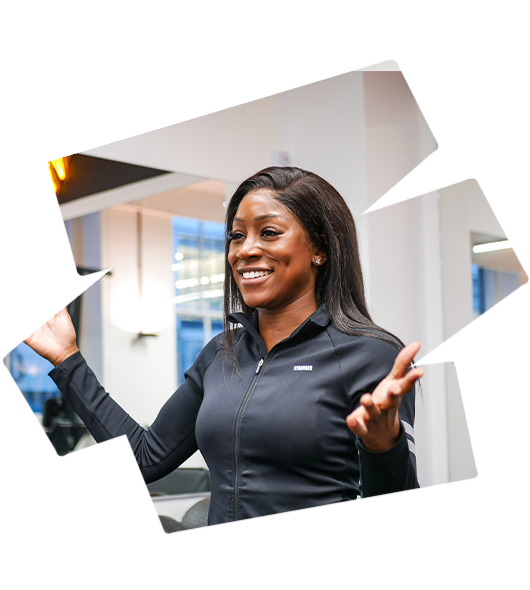 Personal trainer at PT Workspace encouraging clients to book gym rental in London