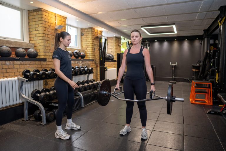 Strength Training Womens legs with Female Personal Trainer Female Personal Trainer exercise legs